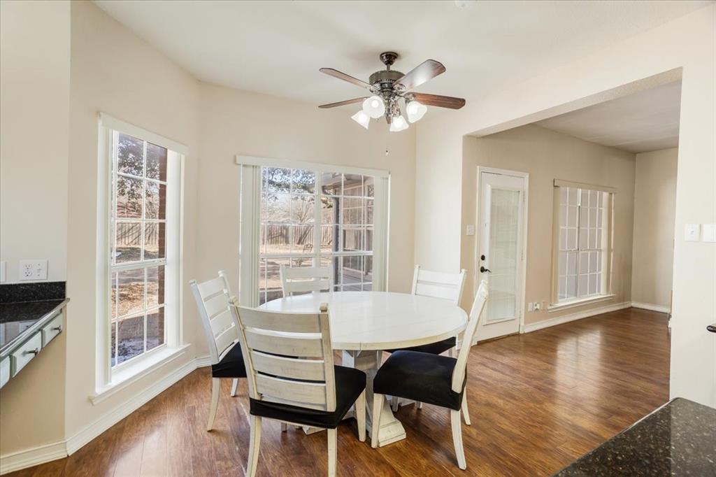 227 North Hopson Street Van Alstyne, TX 75495 - Photo 10 of 38 a view of a dining room with furniture window and wooden floor