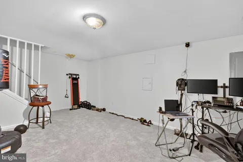 a room with gym equipment and a window