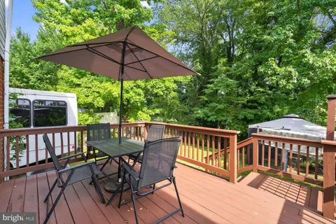 a view of a deck with furniture and a deck