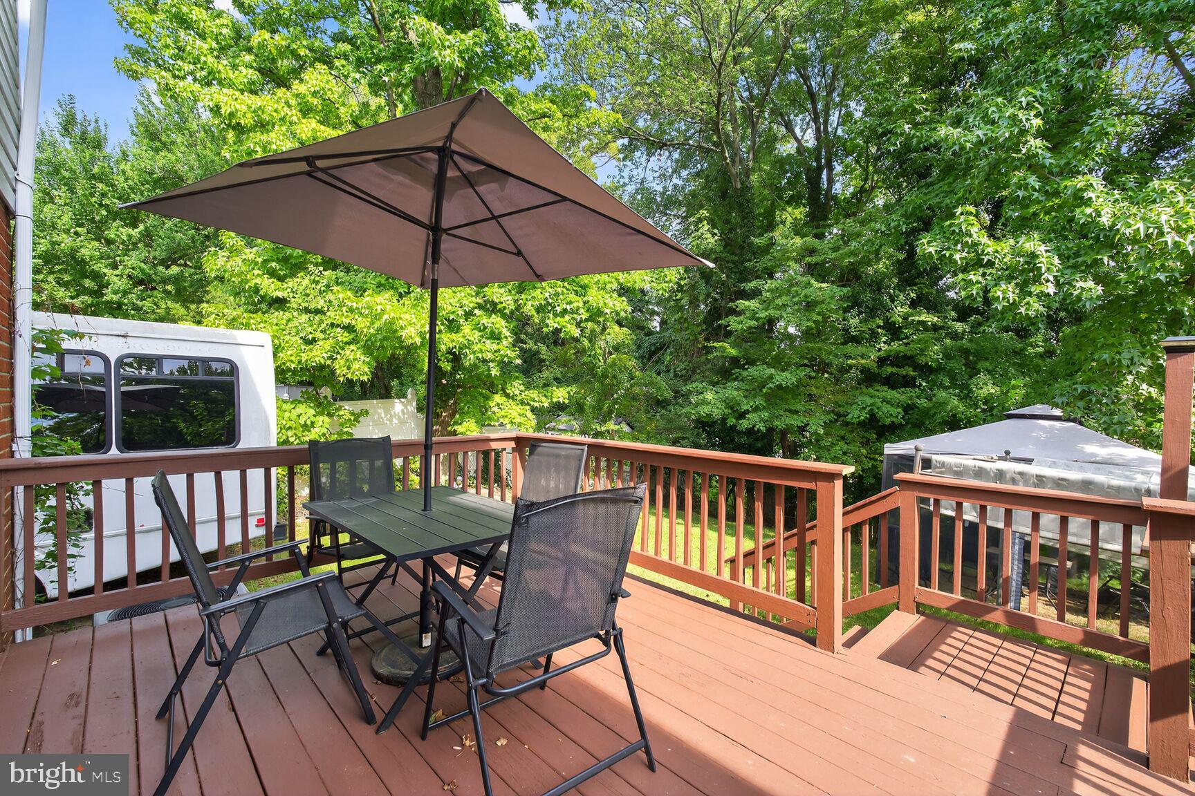4513 Akron Street Temple Hills, MD 20748 - Photo 13 of 15 a view of a deck with furniture and a deck