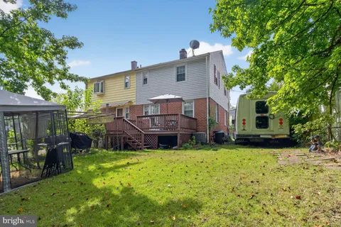 a view of a house with a yard porch and sitting area