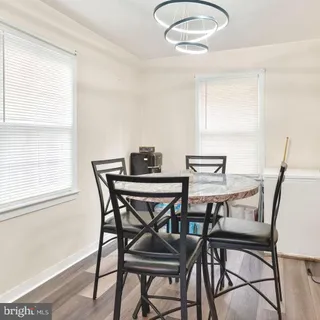 a view of a dining room with furniture and window