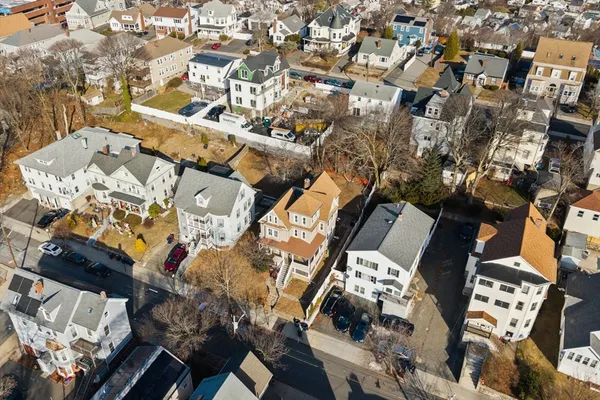 an aerial view of residential houses with outdoor space