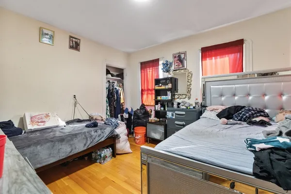 a room with a bed and furniture