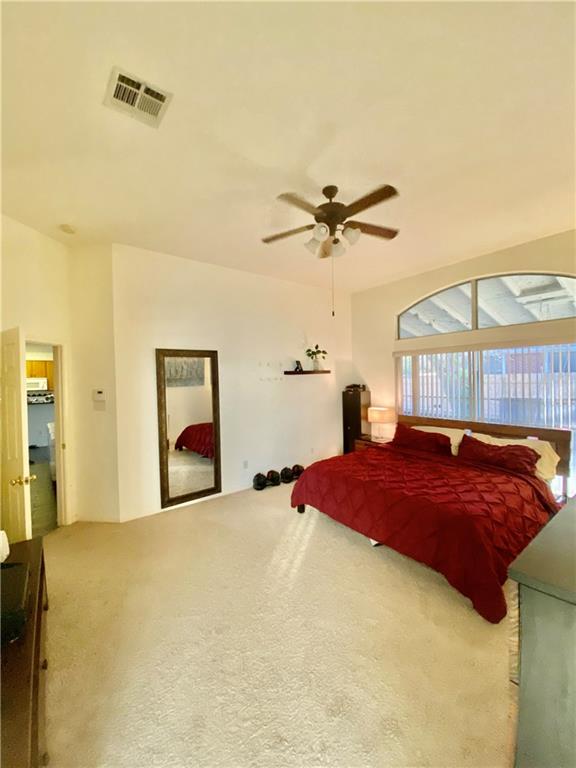 15802 Garrison Circle Austin, TX 78717 - Photo 15 of 17 a bedroom with a bed and a chandelier