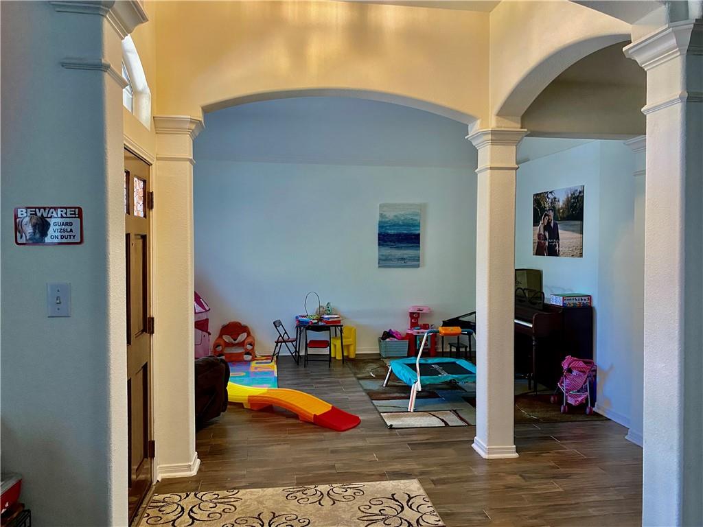 15802 Garrison Circle Austin, TX 78717 - Photo 3 of 17 a view of play room with windows and toys