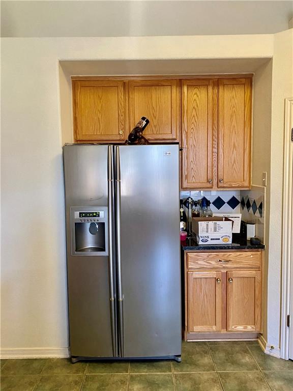 15802 Garrison Circle Austin, TX 78717 - Photo 8 of 17 a view of a refrigerator in kitchen and a window