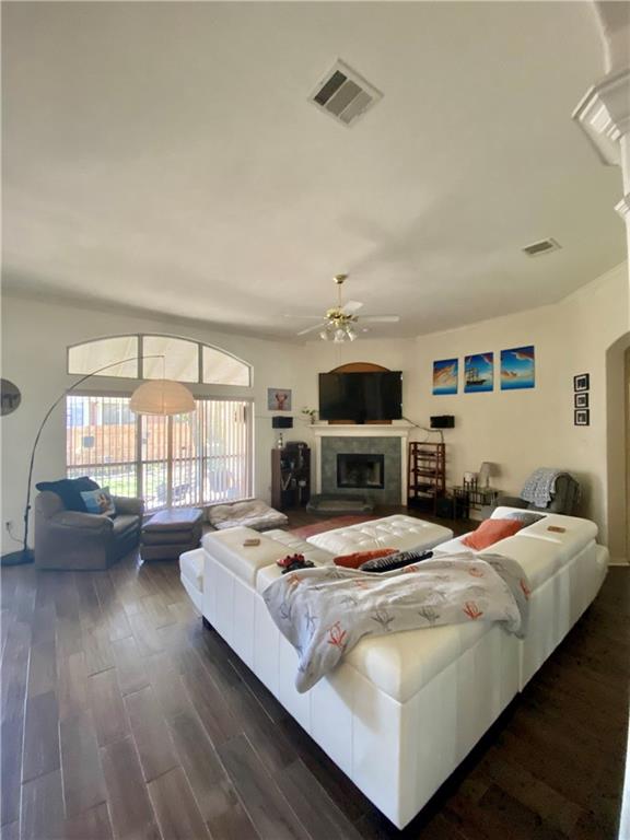 15802 Garrison Circle Austin, TX 78717 - Photo 9 of 17 a bedroom with a large bed a flat tv screen and a couch