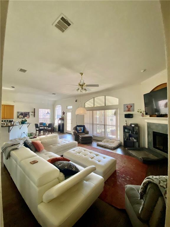 15802 Garrison Circle Austin, TX 78717 - Photo 10 of 17 a living room with furniture fireplace and a flat screen tv