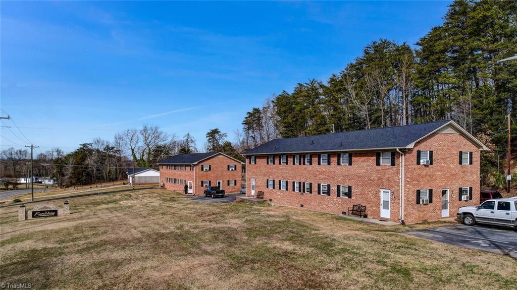 5221 Highway 700 Eden, NC 27288 - Photo 2 of 38 2 brick exterior buildings with a new roof. windows, exterior doors and porch lights have been replaced