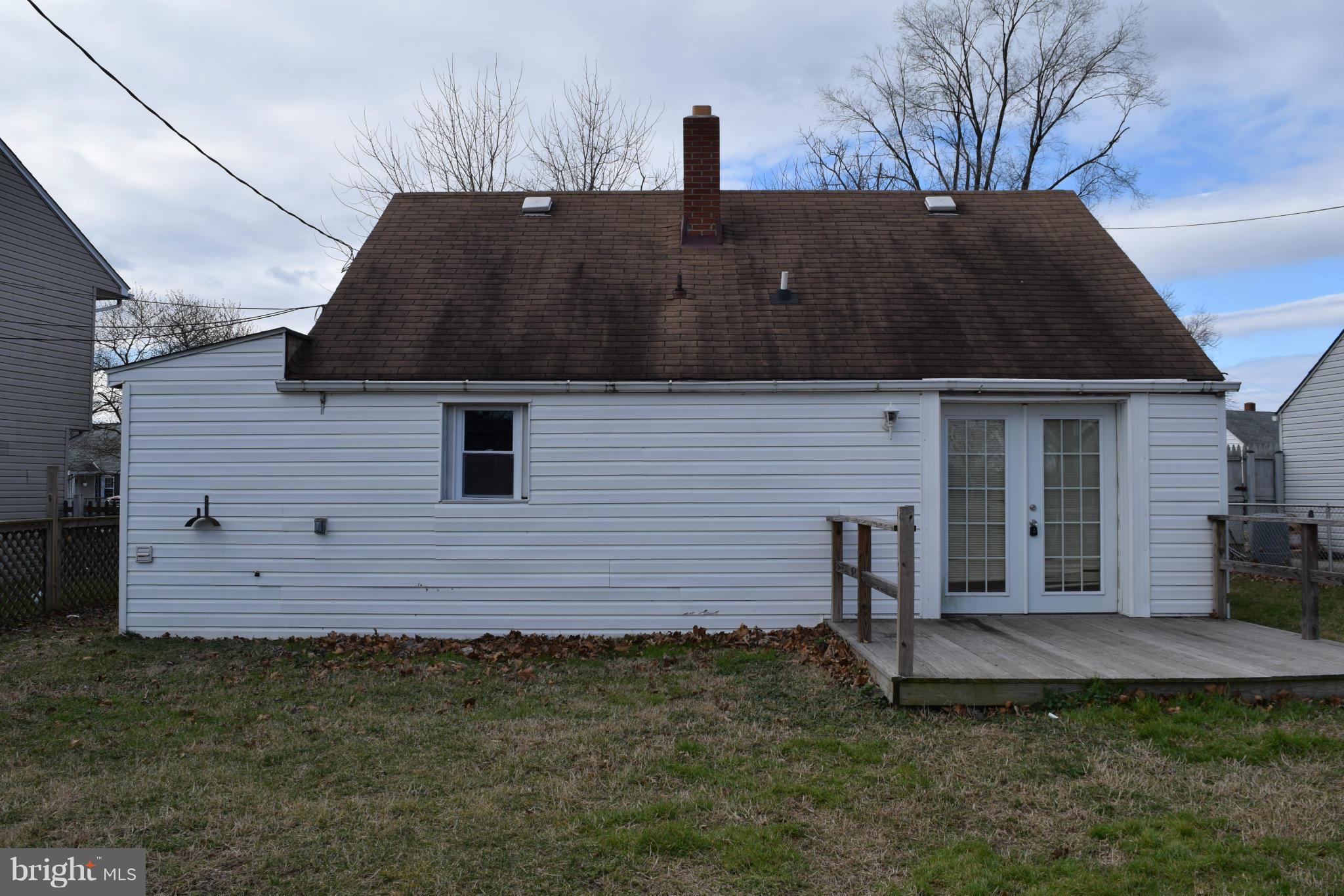 7737 Fairgreen Road Baltimore, MD 21222 - Photo 19 of 28 a front view of a house with a yard