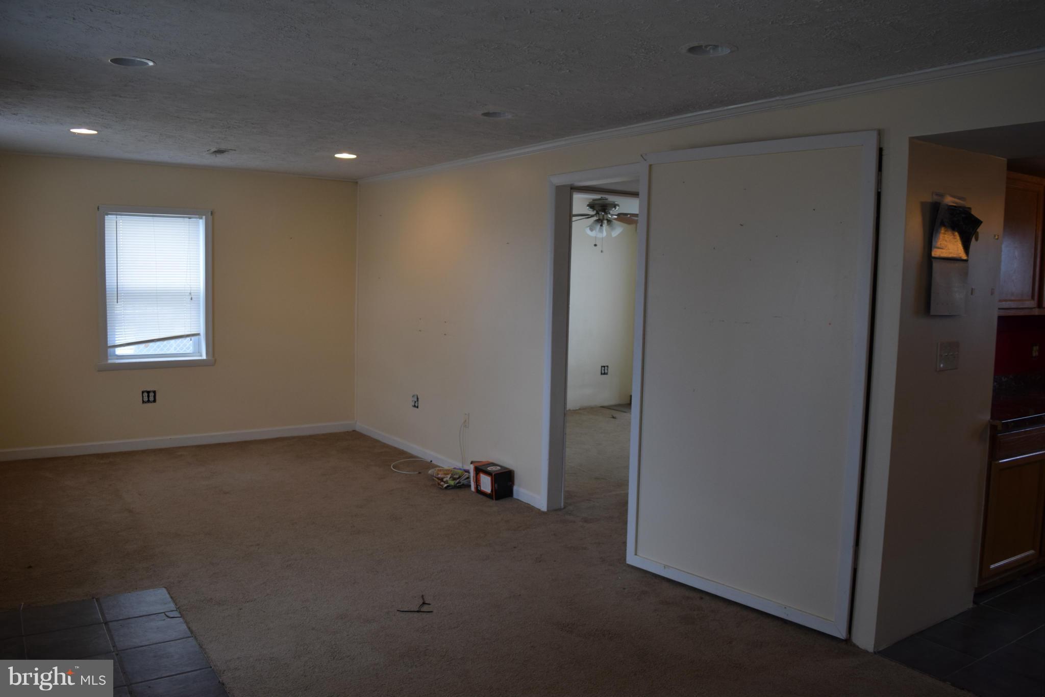 7737 Fairgreen Road Baltimore, MD 21222 - Photo 3 of 28 a view of a livingroom with a hallway