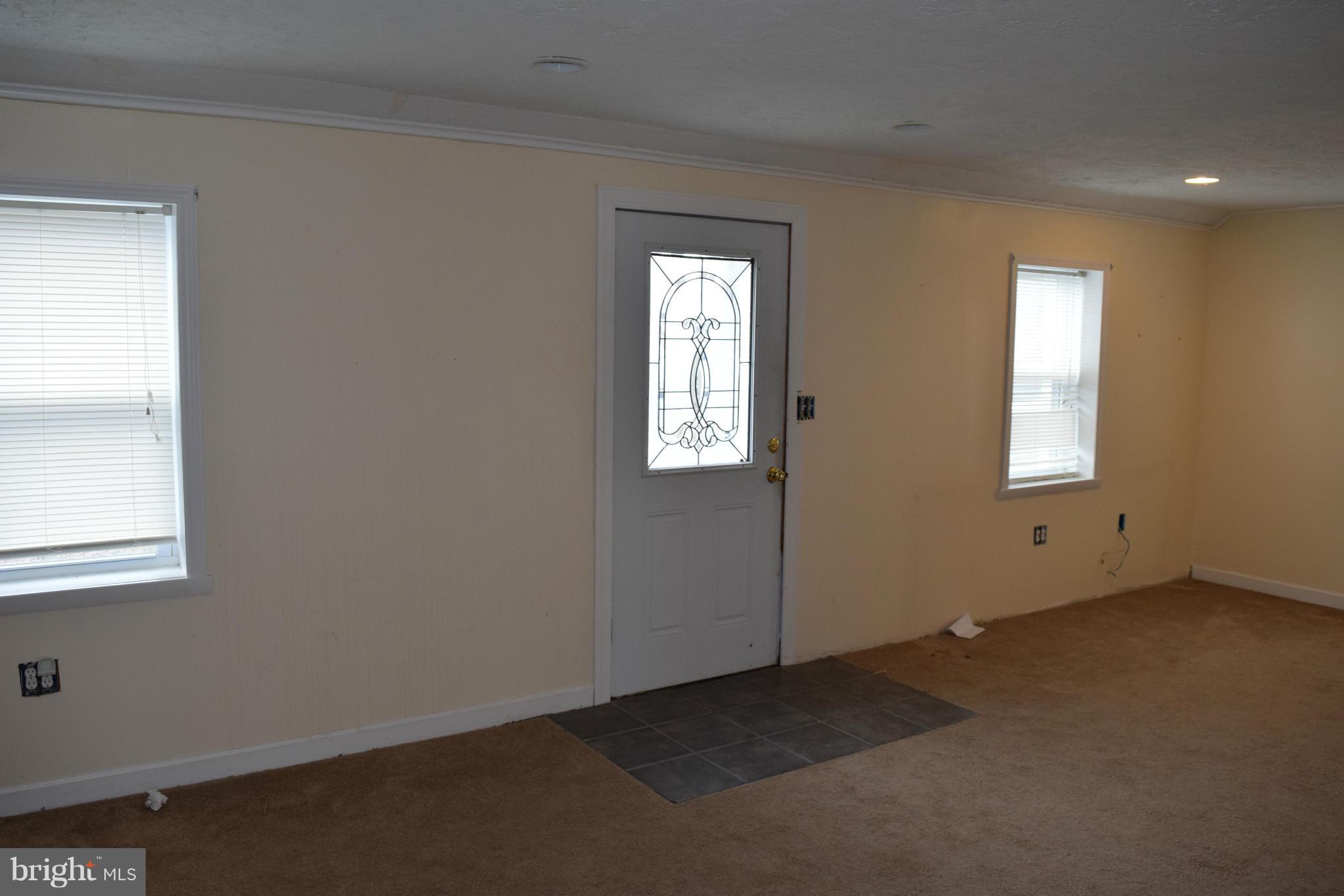 7737 Fairgreen Road Baltimore, MD 21222 - Photo 5 of 28 an empty room with windows