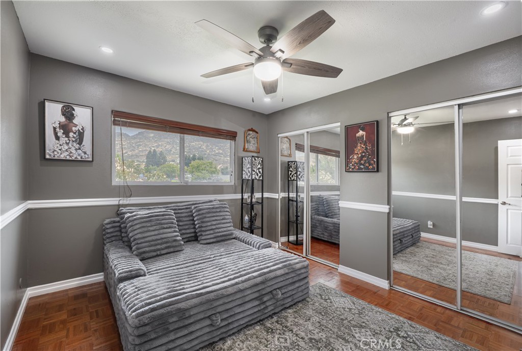 2203 Homewood Avenue Simi Valley, CA 93063 - Photo 21 of 37 a bedroom with a large bed and a chandelier
