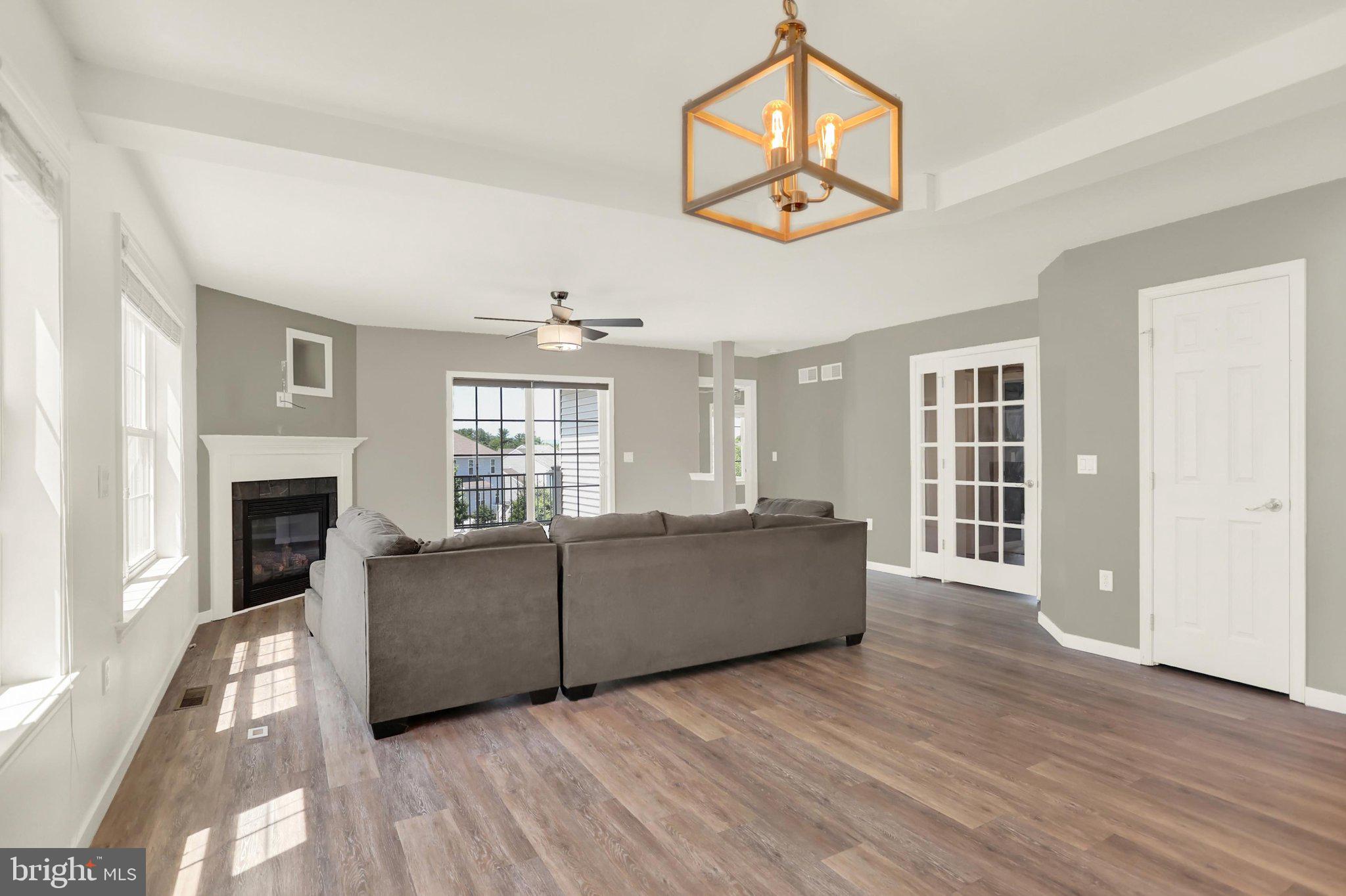 143 Spring Meadows Road Manchester, PA 17345 - Photo 6 of 48 a living room with furniture and a fireplace