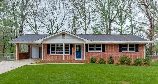 front view of a house with a yard