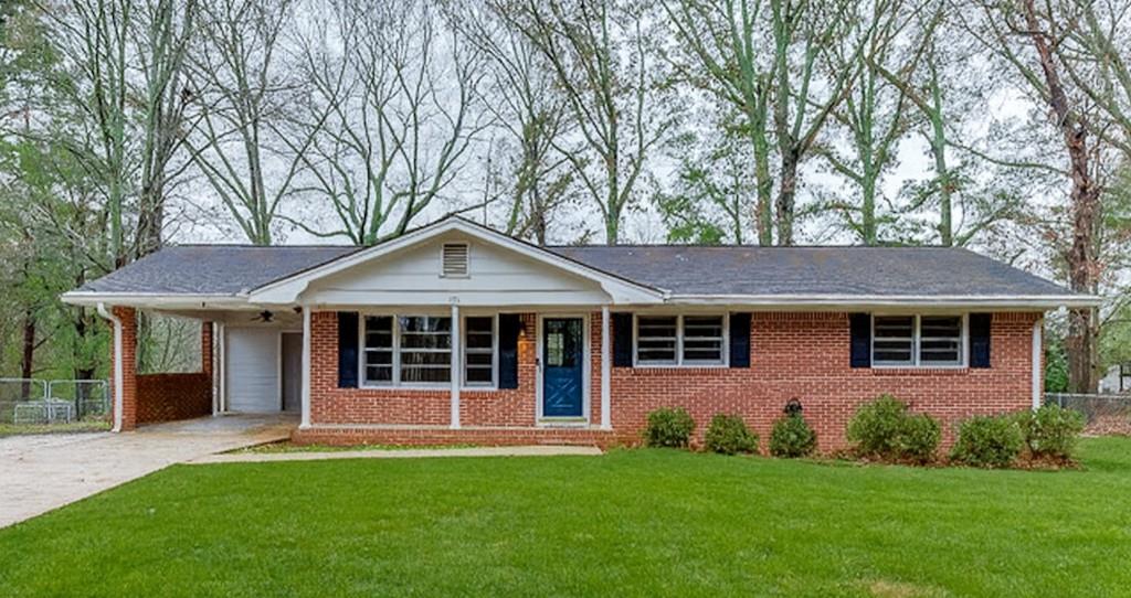 front view of a house with a yard