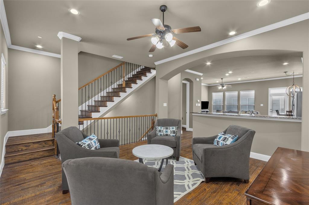 5724 Robbie Road Plano, TX 75024 - Photo 11 of 29 a living room with furniture and a chandelier
