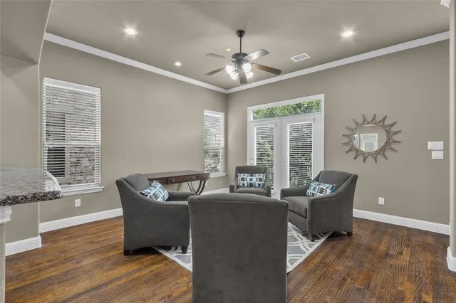 a work room with furniture and wooden floor