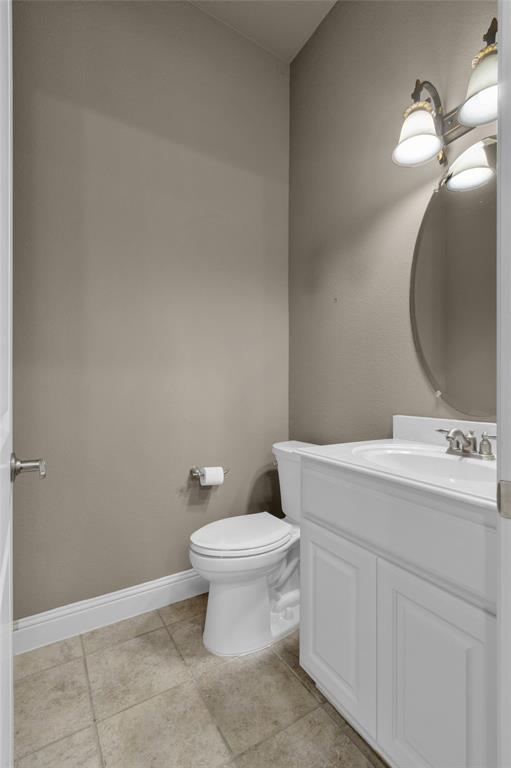 5724 Robbie Road Plano, TX 75024 - Photo 14 of 29 a bathroom with a sink and a mirror