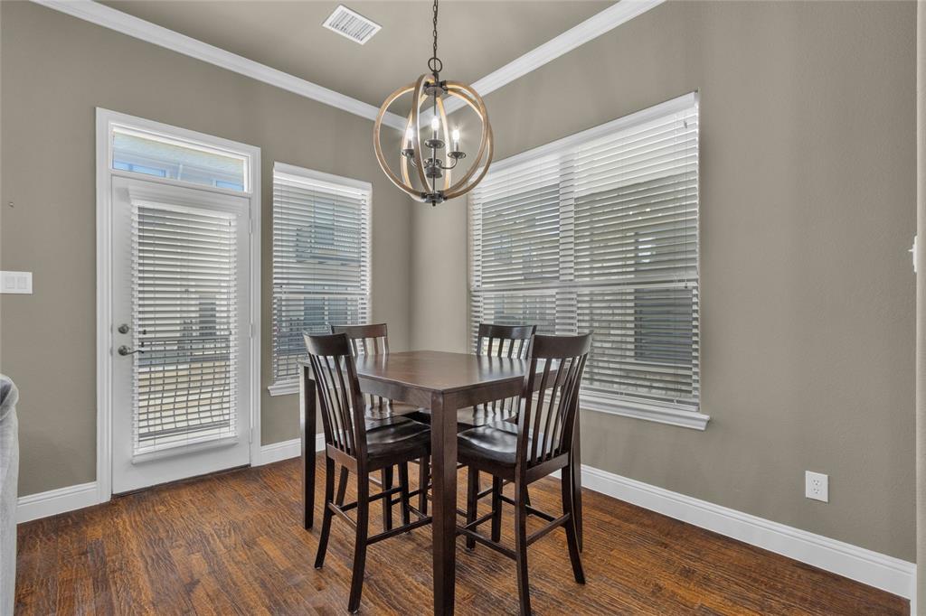 5724 Robbie Road Plano, TX 75024 - Photo 16 of 29 a view of a dining room with furniture window and wooden floor