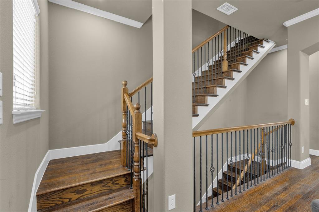 5724 Robbie Road Plano, TX 75024 - Photo 19 of 29 a view of staircase with railing and white walls