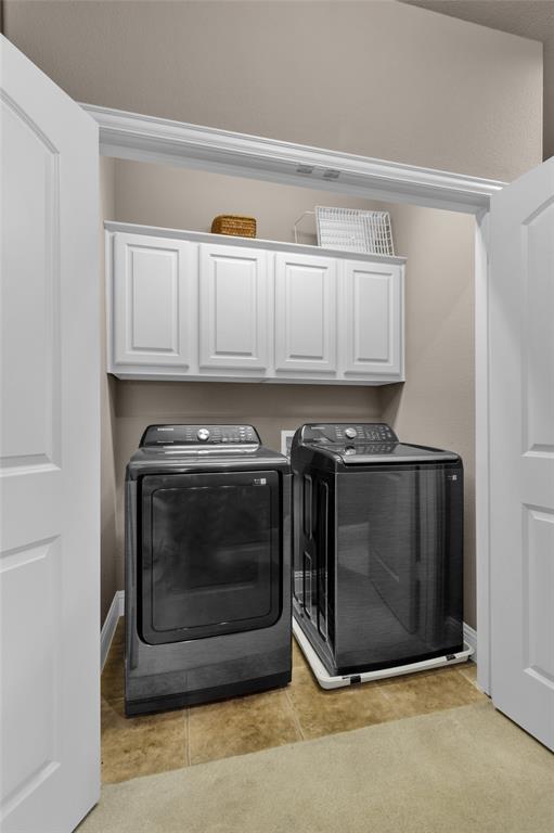 5724 Robbie Road Plano, TX 75024 - Photo 28 of 29 a kitchen with granite countertop a stove top oven and cabinets