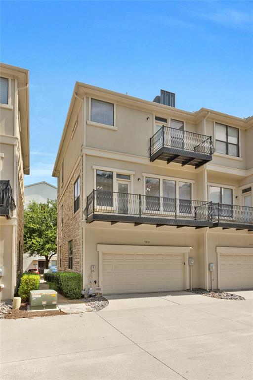 5724 Robbie Road Plano, TX 75024 - Photo 29 of 29 a front view of a building with a garden and plants