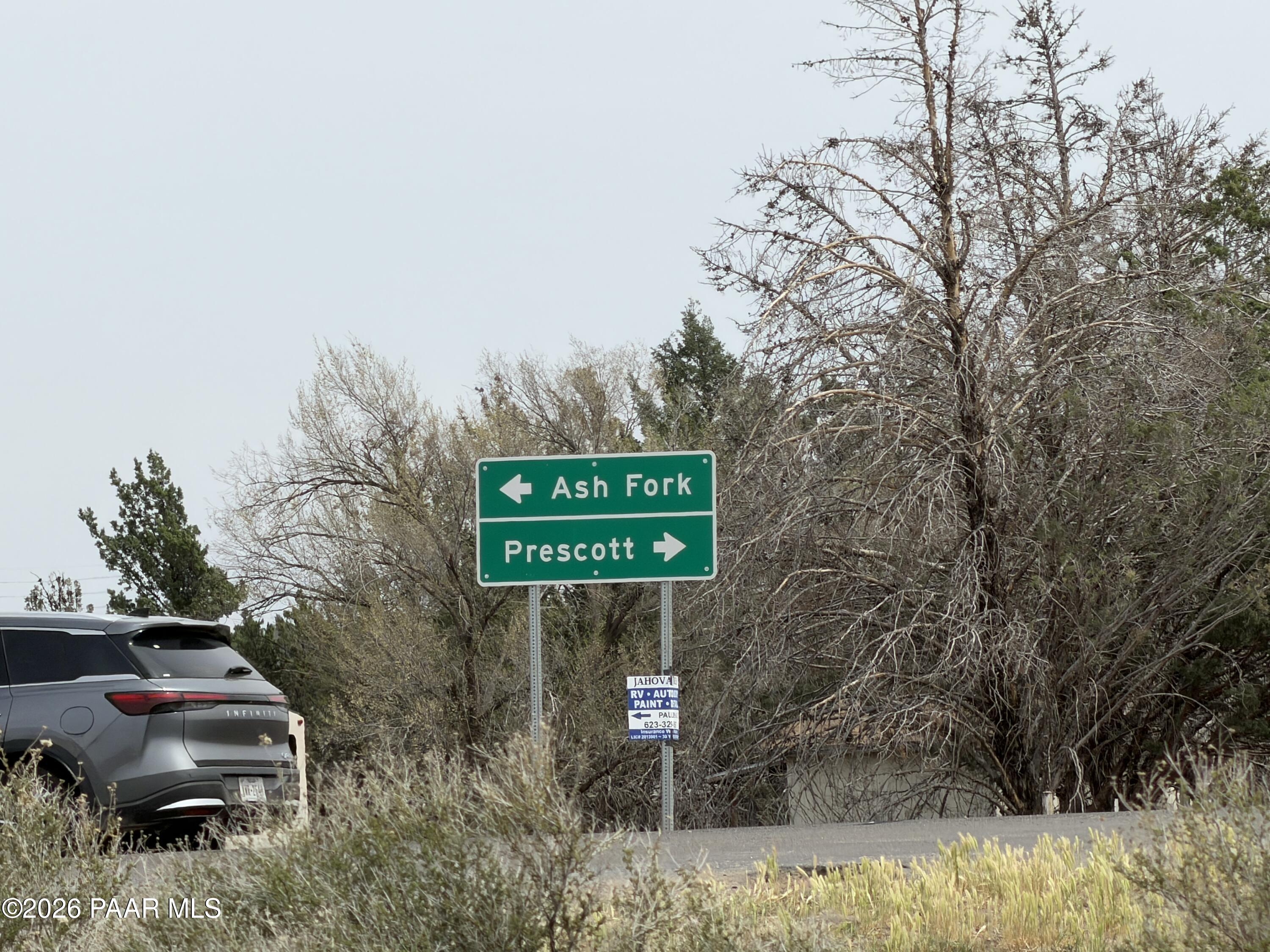 3889 West Onyx Road Paulden, AZ 86334 - Photo 46 of 113 a sign that is on the side of a road