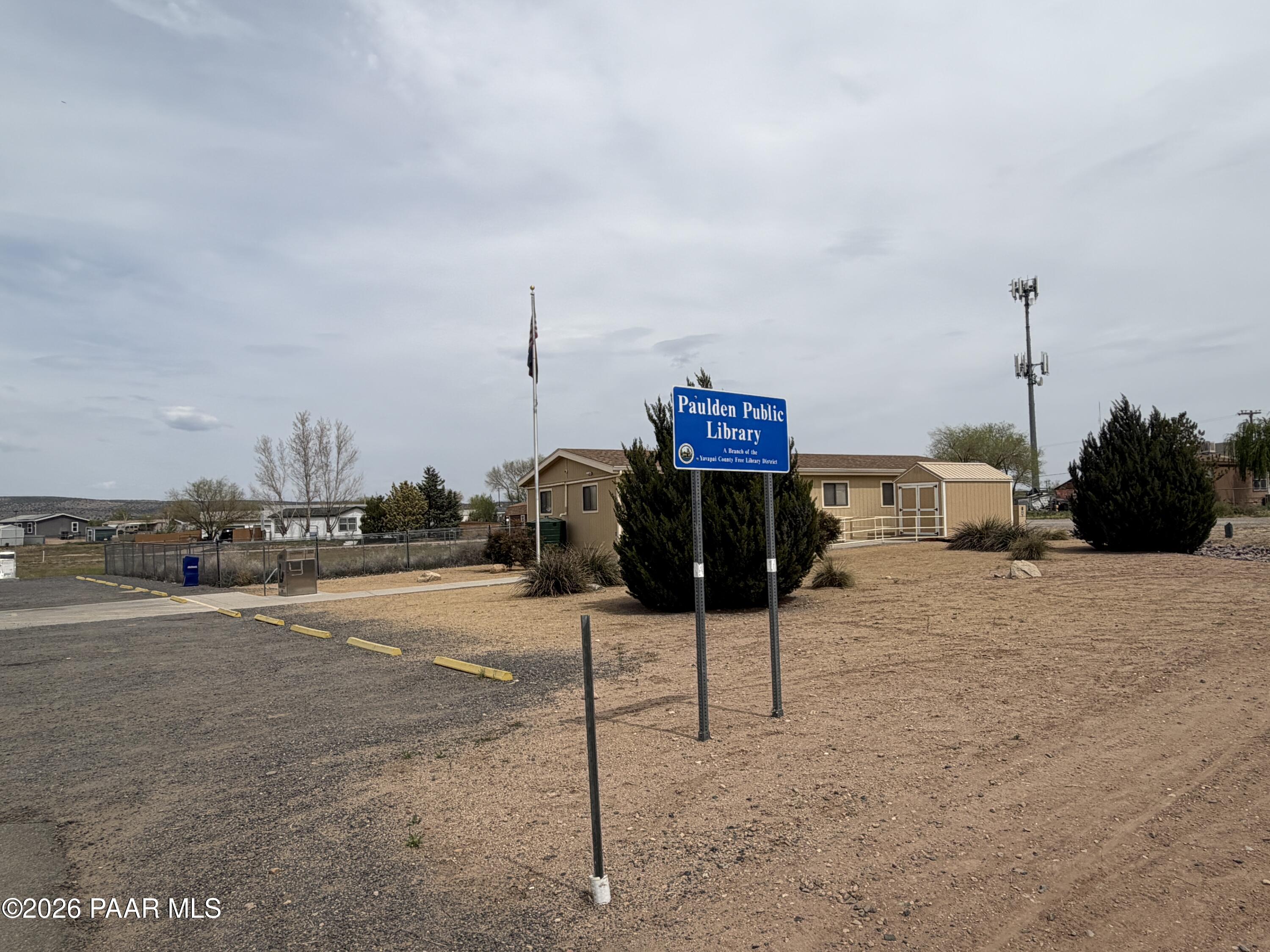 3889 West Onyx Road Paulden, AZ 86334 - Photo 77 of 113 a street sign on a sidewalk next to a road