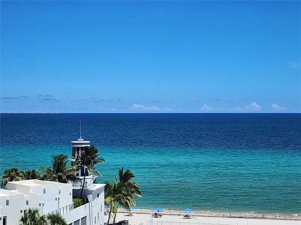 a front view of a building with sitting area