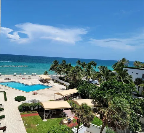 a view of swimming pool with outdoor seating