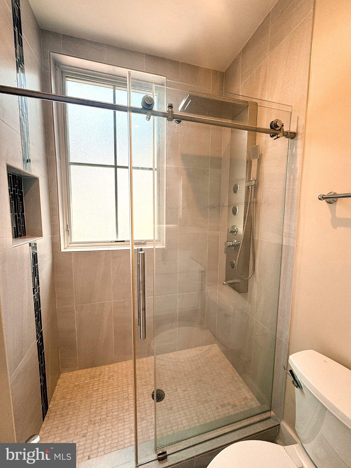 625 Park Road Northwest Washington, DC 20010 - Photo 15 of 22 Sleek modern shower with natural light.