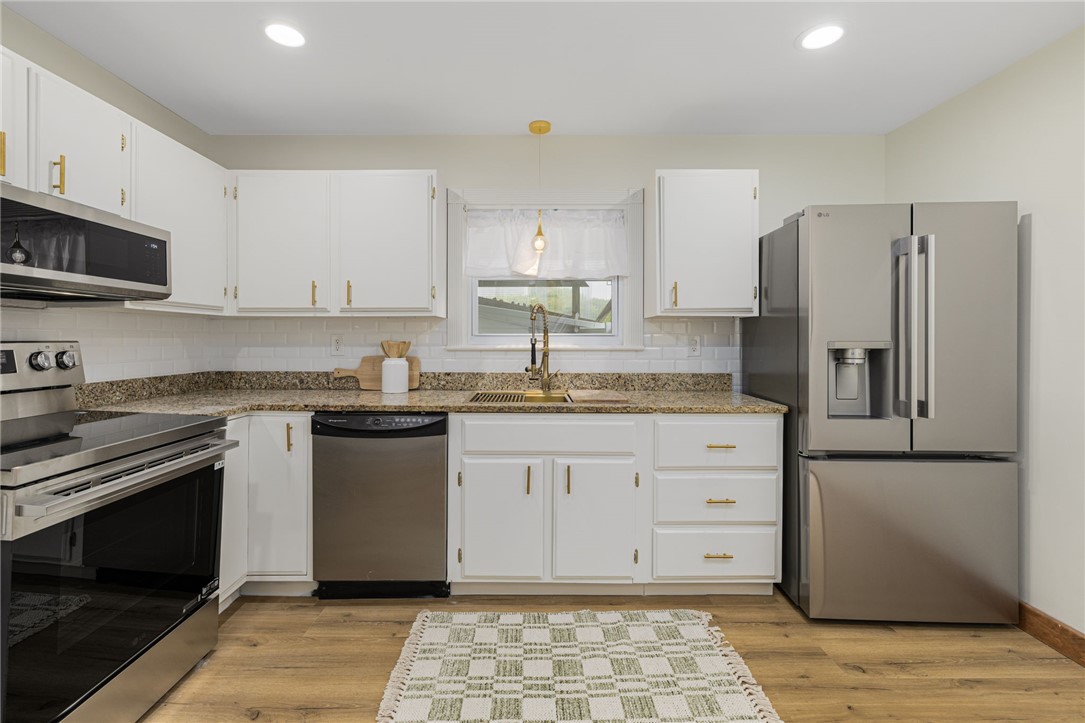 461 River Road Lincoln, RI 02865 - Photo 5 of 32 New utility sink and dandelion pendant light