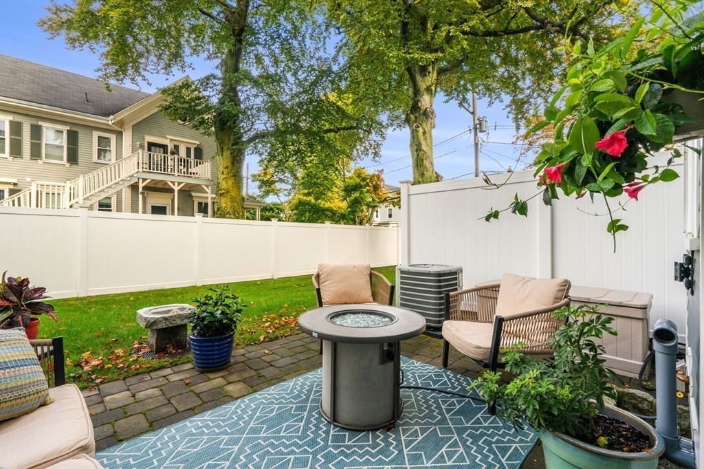 25 Cherry Street, Unit 3 Danvers, MA 01923 - Photo 13 of 27 a view of a chairs and table in the patio