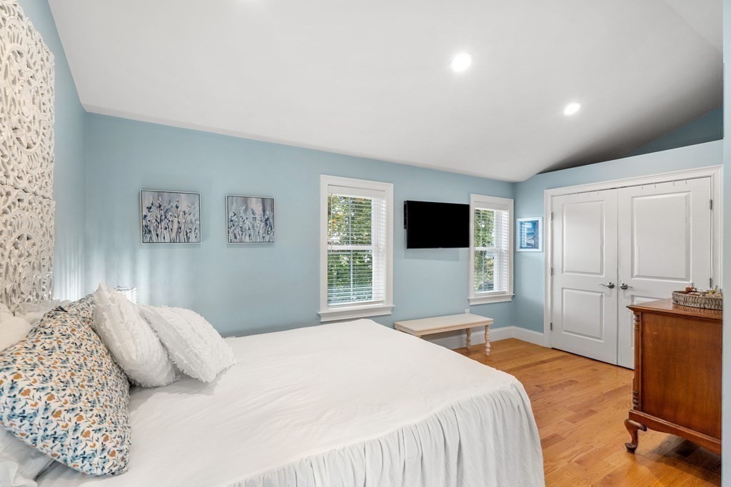 25 Cherry Street, Unit 3 Danvers, MA 01923 - Photo 21 of 27 a bedroom with a bed and a flat screen tv