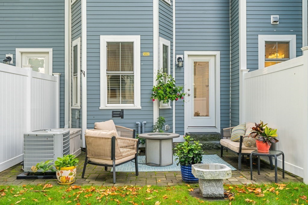 25 Cherry Street, Unit 3 Danvers, MA 01923 - Photo 26 of 27 a outdoor living room with patio furniture and a potted plant