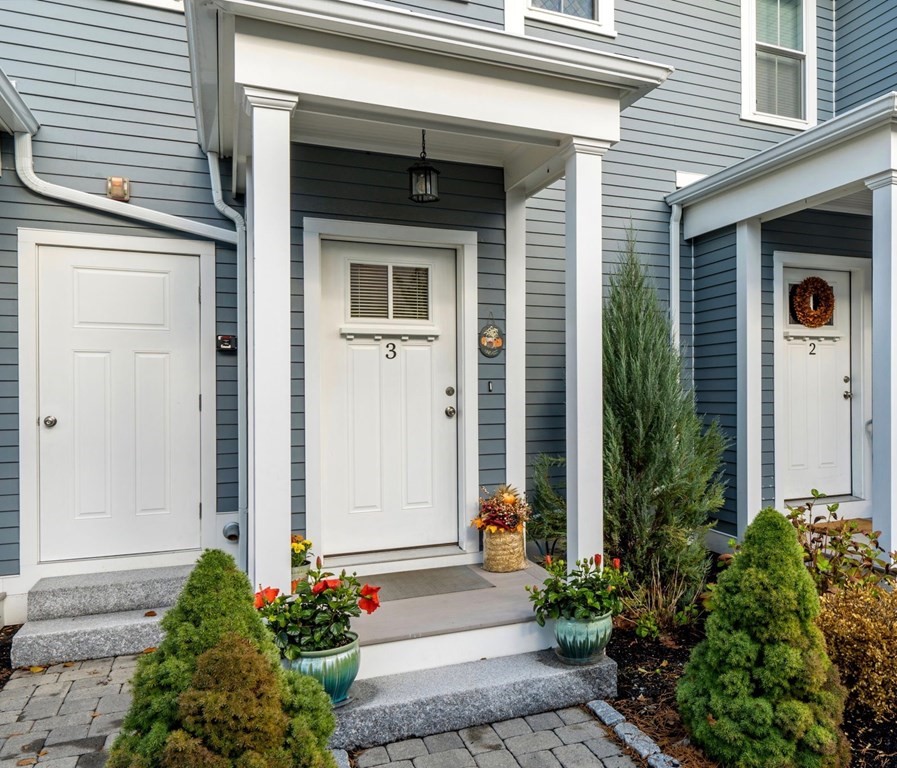 25 Cherry Street, Unit 3 Danvers, MA 01923 - Photo 27 of 27 a front view of a house with a garden