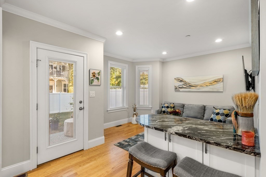 25 Cherry Street, Unit 3 Danvers, MA 01923 - Photo 4 of 27 a living room with furniture and a table