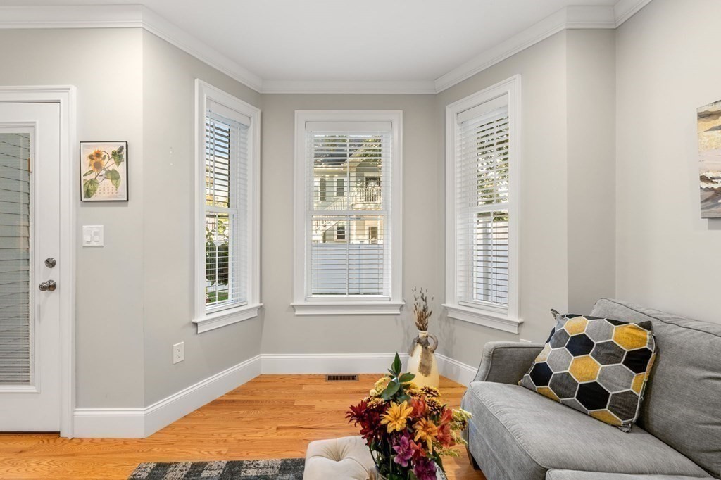 25 Cherry Street, Unit 3 Danvers, MA 01923 - Photo 9 of 27 a living room with furniture and a window