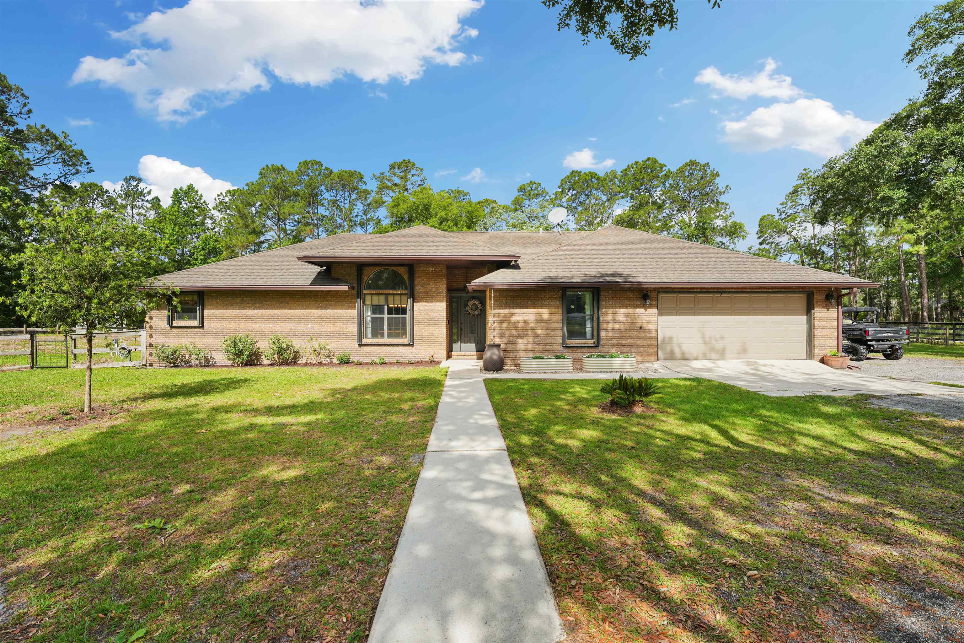 1805 Bennett Road St. Augustine, FL 32092 - Photo 1 of 65 a front view of a house with a yard