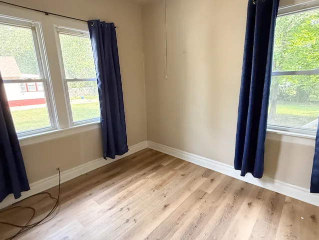 a view of an empty room and window