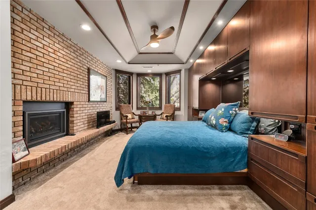 a bedroom with furniture and a fireplace