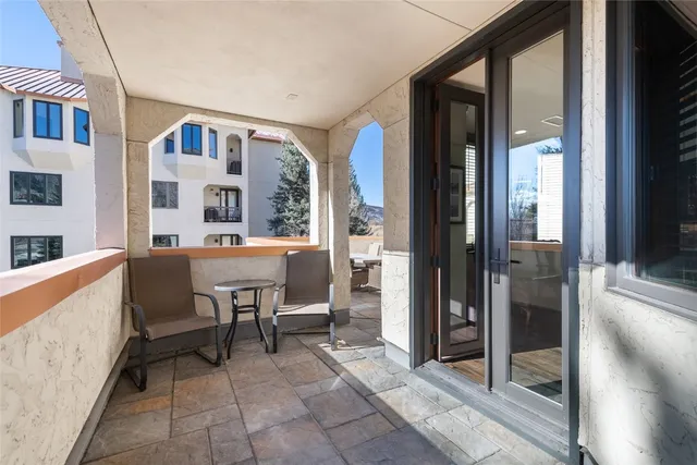 a view of a dining room with furniture and window