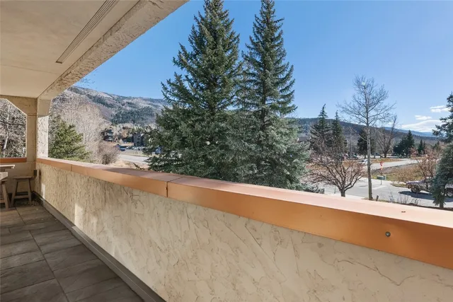 a view of a garage with trees