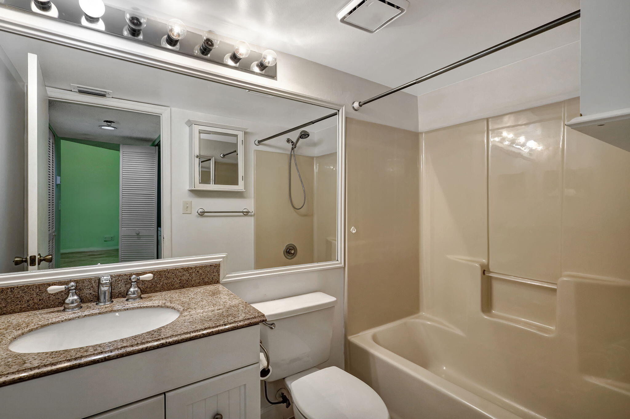 320 Northwest 67th Street, Unit C207 Boca Raton, FL 33487 - Photo 14 of 39 a bathroom with a granite countertop sink toilet and shower