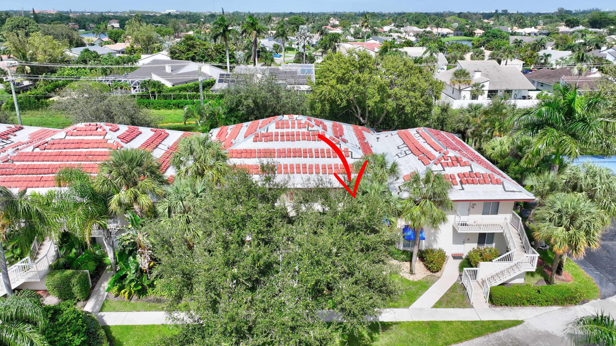320 Northwest 67th Street, Unit C207 Boca Raton, FL 33487 - Photo 28 of 39 an aerial view of a house