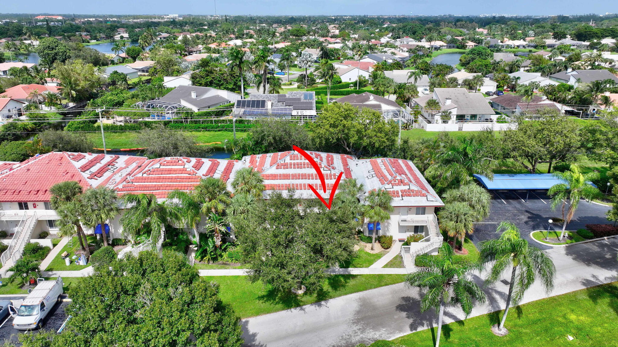 320 Northwest 67th Street, Unit C207 Boca Raton, FL 33487 - Photo 29 of 39 an aerial view of residential houses with outdoor space and trees