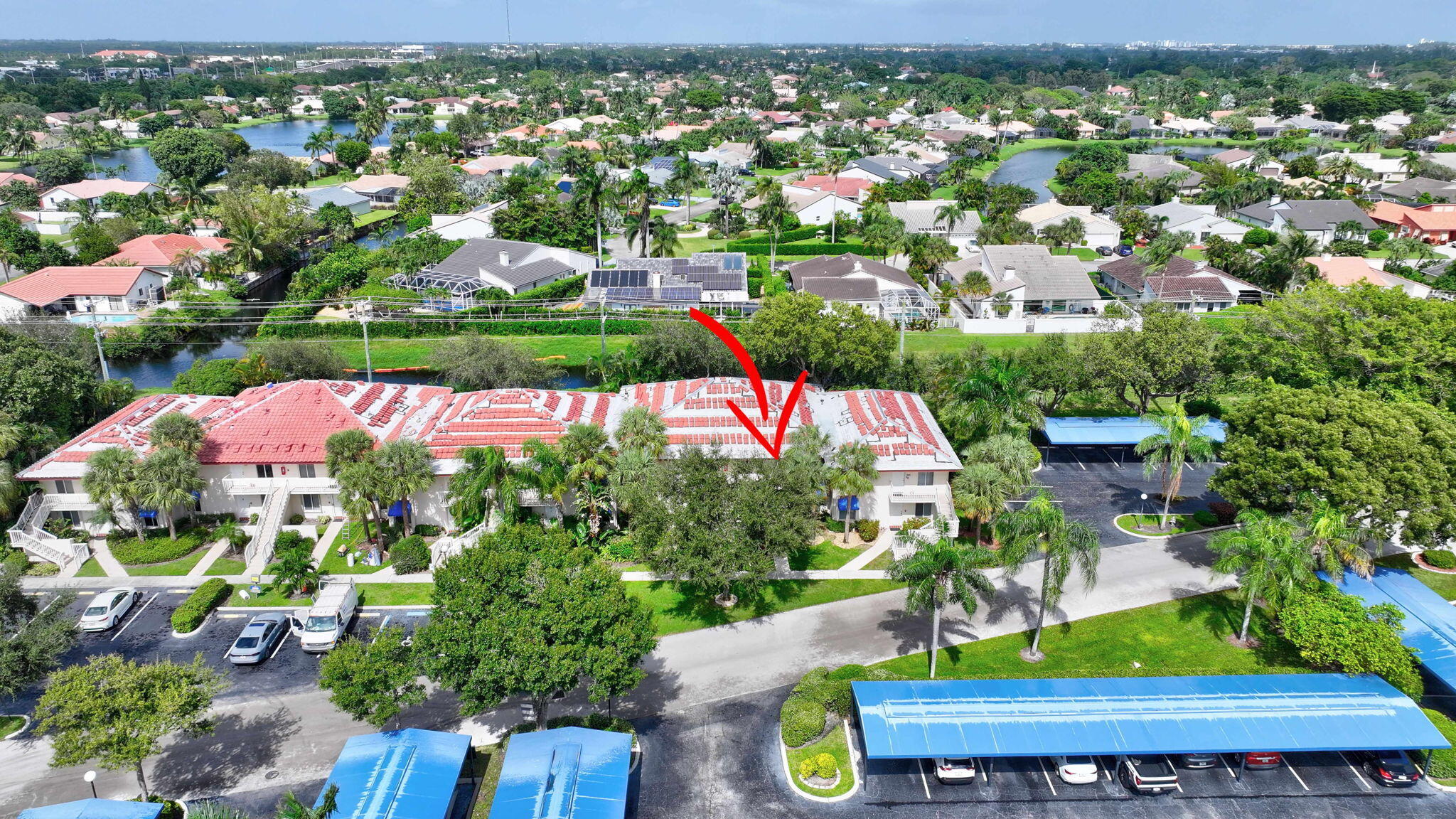 320 Northwest 67th Street, Unit C207 Boca Raton, FL 33487 - Photo 30 of 39 an aerial view of residential houses with outdoor space and street view
