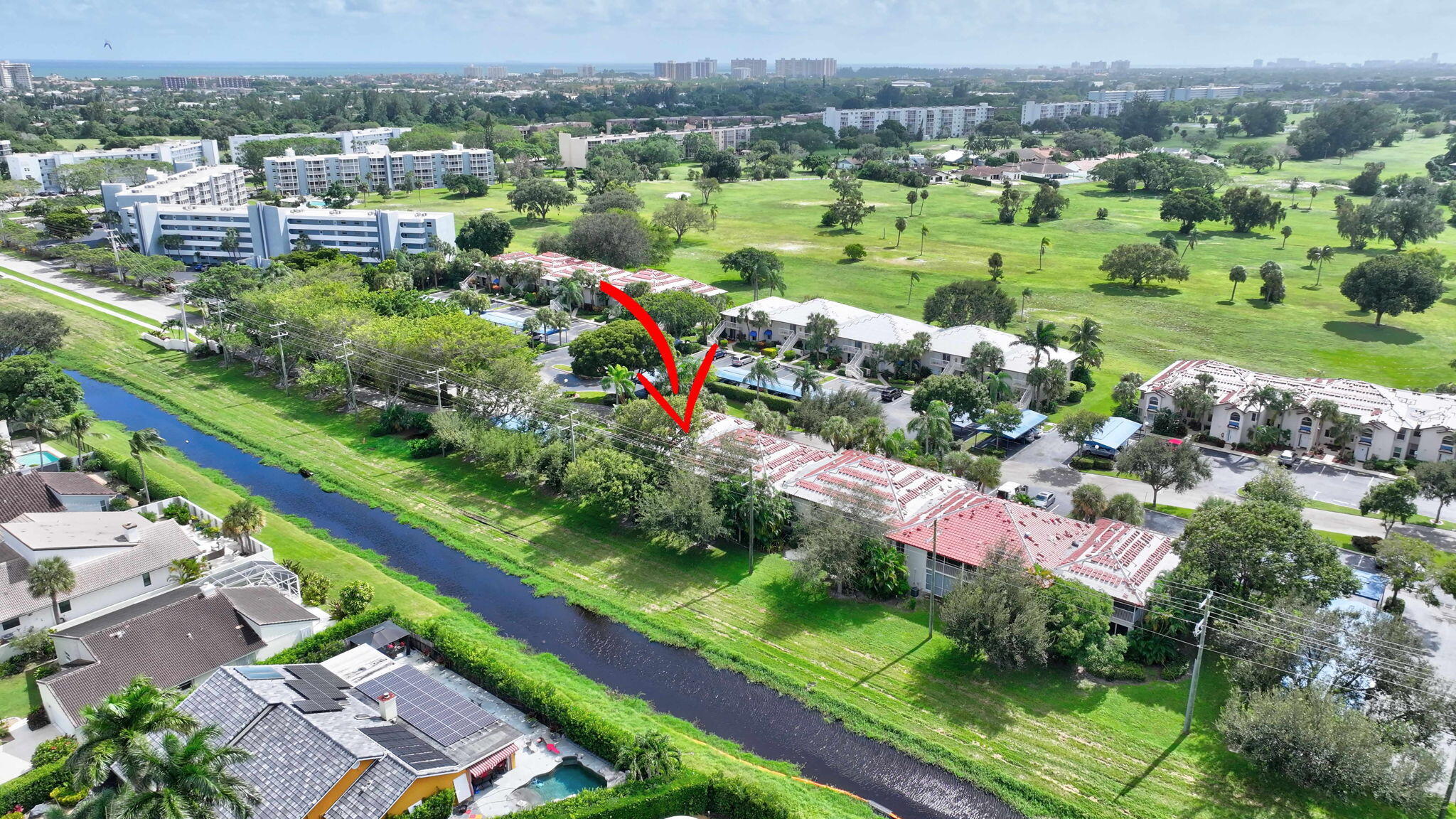320 Northwest 67th Street, Unit C207 Boca Raton, FL 33487 - Photo 35 of 39 an aerial view of lake residential houses with outdoor space and seating